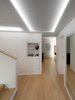 Modern home with Staircase and Wood Railing. Interior Photo 8 of PD House