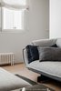 Modern home with Living Room, Sofa, Ceiling Lighting, and Light Hardwood Floor. In muted grey Patricia Urquiola’s Super Beam sofa is dressed with Ralph Lauren cushions Photo 5 of The Oak Residence by Quiet Studios