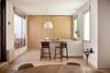 Modern home with Kitchen, Wood Counter, Wood Cabinet, and Ceiling Lighting. Oak storage seamlessly blends into the walls of the contemporary kitchen.
Photo of The Oak Residence by Quiet Studios