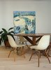 Modern home with Dining Room, Table, Ceiling Lighting, and Light Hardwood Floor. Restored original Charles Eames chairs furnish the dining room Photo 4 of The Oak Residence by Quiet Studios