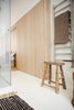 Modern home with Bedroom, Dresser, and Ceiling Lighting. Oak walls continue to the master ensuite Photo 10 of The Oak Residence by Quiet Studios