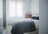 Modern home with Bedroom, Bed, Ceiling Lighting, and Light Hardwood Floor. Blue hues in the guest bedroom Photo 13 of The Oak Residence by Quiet Studios