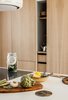 Modern home with Kitchen, Wood Counter, Wood Cabinet, Light Hardwood Floor, and Ceiling Lighting. Oak panelling conceals the kitchen storage spaces
Photo 3 of The Oak Residence by Quiet Studios
