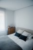 Modern home with Bedroom, Bed, Ceiling Lighting, and Light Hardwood Floor. The guest room Photo 14 of The Oak Residence by Quiet Studios