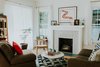 Modern home with Living Room, Gas Burning Fireplace, Chair, Sofa, Coffee Tables, and Light Hardwood Floor. Living room Photo of Oak Cliff Home