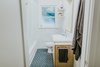 Modern home with Bath Room, Wood Counter, Ceramic Tile Floor, Alcove Tub, Wall Lighting, Ceiling Lighting, Drop In Sink, Open Shower, Marble Wall, and One Piece Toilet. Main bath Photo 8 of Oak Cliff Home