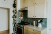 Modern home with Kitchen, Engineered Quartz Counter, Wood Cabinet, Ceramic Tile Backsplashe, Range, Range Hood, and Cooktops. Kitchen Photo 6 of Oak Cliff Home