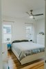 Modern home with Bedroom, Bed, Dresser, Night Stands, Ceiling Lighting, and Light Hardwood Floor. Bedroom (master) Photo 10 of Oak Cliff Home