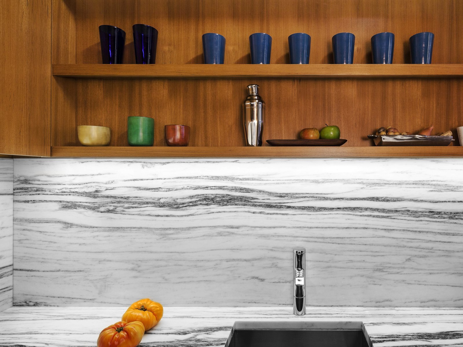 We had the stone counter and backsplash cut from the same slab of Vermont marble, achieving a continuous graphic pattern.