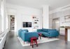 Modern home with Living Room, Sofa, Coffee Tables, and End Tables. Two sliding doors can be opened to lend access and visibility to the study, and allow views and light to extend the entire length of the apartment. Photo of 5th Avenue Apartment