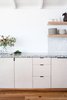 Modern home with Kitchen, Subway Tile Backsplashe, Open Cabinet, Medium Hardwood Floor, and Wood Cabinet. Detail of kitchen. Photo 5 of Waterfront House