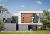 Modern home with Exterior, Wood Siding Material, Concrete Siding Material, Shingles Roof Material, Flat RoofLine, and House Building Type. A protruding wall hides an open staircase leading to the second floor studio apartment in the rear. The "C" shaped volume houses the living room area and open kitchen. Photo of Gillingham Strauss Residence