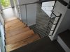 Modern home with Staircase, Metal Railing, Cable Railing, and Wood Tread. The custom open wood and steel stair case is the showpiece element in the foyer and guides visitors to the second floor living quarters. Photo 4 of Gillingham Strauss Residence