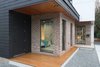 Modern home with Exterior, House Building Type, Metal Roof Material, Brick Siding Material, and Shed RoofLine. entry area with overhangs to manage solar gain Photo 2 of 1908 Oaklawn
