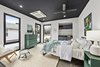Modern home with Bedroom, Bed, Dresser, Concrete Floor, Chair, Ceiling Lighting, Accent Lighting, and Storage. in-law suite, airbnb, granny flat, office, master suite with mini split hvac system Photo 8 of 1908 Oaklawn