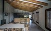 Modern home with Dining Room, Table, Chair, Stools, Bar, Lamps, Ceiling Lighting, Concrete Floor, and Gas Burning Fireplace. Open Kitchen and dinning room-VILLA CP Photo 3 of Villa CP