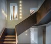 Modern home with Staircase, Metal Tread, Wood Railing, Wood Tread, and Metal Railing. Staircase-VILLA CP Photo 8 of Villa CP