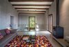 Modern home with Living Room, Sofa, Coffee Tables, Ceiling Lighting, Table Lighting, Concrete Floor, Gas Burning Fireplace, and Standard Layout Fireplace. Living room-VILLA CP Photo 12 of Villa CP