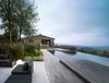 Modern home with Outdoor, Back Yard, Woodland, Trees, Grass, Gardens, Raised Planters, Walkways, Swimming Pools, Tubs, Shower, Metal Patio, Porch, Deck, Infinity Pools, Tubs, Shower, Large Patio, Porch, Deck, Wood Patio, Porch, Deck, Concrete Patio, Porch, Deck, Stone Patio, Porch, Deck, Decking Patio, Porch, Deck, Metal Fences, Wall, Stone Fences, Wall, Concrete Fences, Wall, and Landscape Lighting. Exterior with infinity pool-VILLA CP Photo 13 of Villa CP