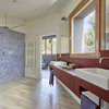 Modern home with Bath Room, Ceiling Lighting, Pedestal Sink, Mosaic Tile Wall, Freestanding Tub, Two Piece Toilet, Light Hardwood Floor, Vessel Sink, Enclosed Shower, and Wood Counter. Creueta House-Bathroom. Photo 12 of Creueta House