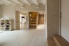Modern home with Living Room, Chair, Wall Lighting, and Light Hardwood Floor. Duplex in Gracia Photo of Duplex in Gracia