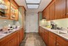 Modern home with Kitchen, Refrigerator, Wall Oven, Cooktops, Range, Range Hood, Metal Counter, Wood Cabinet, Slate Floor, Glass Tile Backsplashe, and Ceiling Lighting. The kitchen has been preserved and modernized with stainless steel Subzero, Fisher & Paykel appliances Photo 4 of The Hill Gowdy House