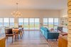 Modern home with Living Room, Sofa, Coffee Tables, Ceiling Lighting, and Pendant Lighting. MH3 interior Photo 2 of MODHAUS III