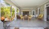 Modern home with Living Room, Wood Burning Fireplace, Wall Lighting, Chair, End Tables, and Ceramic Tile Floor. The "braai" or bbq area Photo 12 of Old Victorian home is fully renovated and becomes a dream property