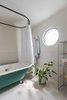 Modern home with Bath Room, Freestanding Tub, Ceramic Tile Floor, Wall Lighting, and Ceramic Tile Wall. bathroom Photo 6 of Casa Milton