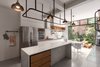 Modern home with Kitchen, Open Cabinet, Terrazzo Floor, Subway Tile Backsplashe, Wall Oven, Marble Counter, and Ceiling Lighting. kitchen Photo 9 of Casa Milton