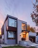 Modern home with Exterior, House Building Type, Brick Siding Material, Metal Siding Material, Glass Siding Material, Wood Siding Material, and Flat RoofLine. South-East Elevation Photo of Brennan Avenue Residence