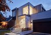 Modern home with Exterior, House Building Type, Wood Siding Material, Brick Siding Material, and Flat RoofLine. Main Entrance Photo 2 of Brennan Avenue Residence