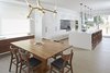 Modern home with Dining Room, Table, Chair, Ceiling Lighting, and Light Hardwood Floor. Dining room and Kitchen Photo 7 of Brennan Avenue Residence