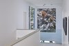 Modern home with Hallway and Light Hardwood Floor. Second floor hallway Photo 9 of Brennan Avenue Residence