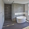 Modern home with Bath Room, Engineered Quartz Counter, Porcelain Tile Floor, Vessel Sink, Freestanding Tub, Open Shower, Ceiling Lighting, Ceramic Tile Wall, and One Piece Toilet. Master ensuite Photo 10 of Brennan Avenue Residence