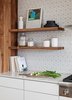 Modern home with Kitchen, Range, Engineered Quartz Counter, White Cabinet, Wood Cabinet, Laminate Cabinet, and Ceramic Tile Backsplashe. Cabinetry and floating shelves by Kaimade, Heath Ceramics wall tile Photo 3 of Los Palmos