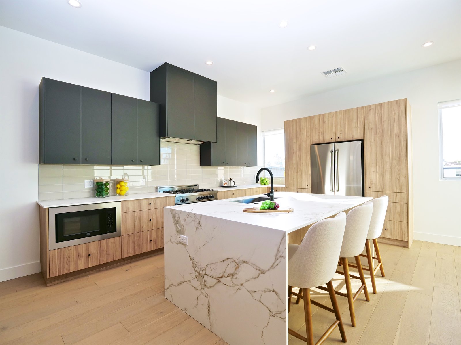 Silestone Dekton countertops, a waterfall island and Bertazzoni appliance package. 