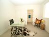Modern home with Bedroom, Ceiling Lighting, and Medium Hardwood Floor. First floor bedroom/office with en suite bath and concrete floors. Photo 4 of Stacks Modern