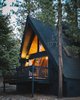 A modern black-on-black A-frame transformation in Big Bear Lake, CA. Photo of Big Bear A-Frame Receives Boho Eclectic Transformation modern home