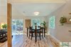 Modern home with Dining Room, Chair, Table, Ceiling Lighting, and Light Hardwood Floor. A dropped ceiling above the dining area creates a more intimate space and allows to define different areas without boundaries. Photo 3 of The Vickery Home