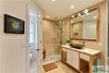 Modern home with Bath Room, Travertine Floor, Open Shower, Recessed Lighting, and Stone Tile Wall. The toilet room off the master bath offers privacy in an open concept bath. Photo 15 of The Vickery Home
