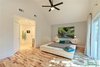 Modern home with Bedroom, Dresser, Night Stands, Bed, Accent Lighting, and Light Hardwood Floor. The master bedroom with the custom platform bed, designed by designATplay. Photo 16 of The Vickery Home