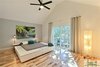 Modern home with Bedroom, Bed, Night Stands, Ceiling Lighting, and Light Hardwood Floor. The new large slider in the bedroom allows access to the new lounging deck. Photo 17 of The Vickery Home