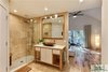 Modern home with Bath Room, Engineered Quartz Counter, Travertine Floor, Vessel Sink, Open Shower, Recessed Lighting, Stone Tile Wall, and Track Lighting. The master bath with the new shower and custom built vanity (designed and built by designATplay). Photo 14 of The Vickery Home