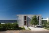 Modern home with Exterior, House Building Type, Concrete Siding Material, and Beach House Building Type. Street Entrance Facade Photo of La Iluminada