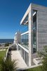 Modern home with Exterior, House Building Type, Concrete Siding Material, and Beach House Building Type. Ocean View Facade Photo 2 of La Iluminada