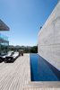 Modern home with Outdoor, Side Yard, Infinity Pools, Tubs, Shower, Wood Patio, Porch, Deck, Concrete Fences, Wall, and Concrete Patio, Porch, Deck. Patio/Pool Photo 3 of La Iluminada