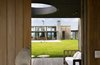 Modern home with Exterior, Beach House Building Type, House Building Type, Wood Siding Material, Stone Siding Material, Concrete Siding Material, and Flat RoofLine. Street Entrance Photo 2 of La Boyita