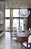 Modern home with Dining Room, Chair, Table, Ceiling Lighting, Pendant Lighting, Concrete Floor, Wood Burning Fireplace, and Two-Sided Fireplace. Dining Room Photo 7 of La Boyita