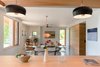 Modern home with Kitchen, Pendant Lighting, and Wood Counter. Kitchen Island looking toward Living Photo 15 of The North Bridge Residence